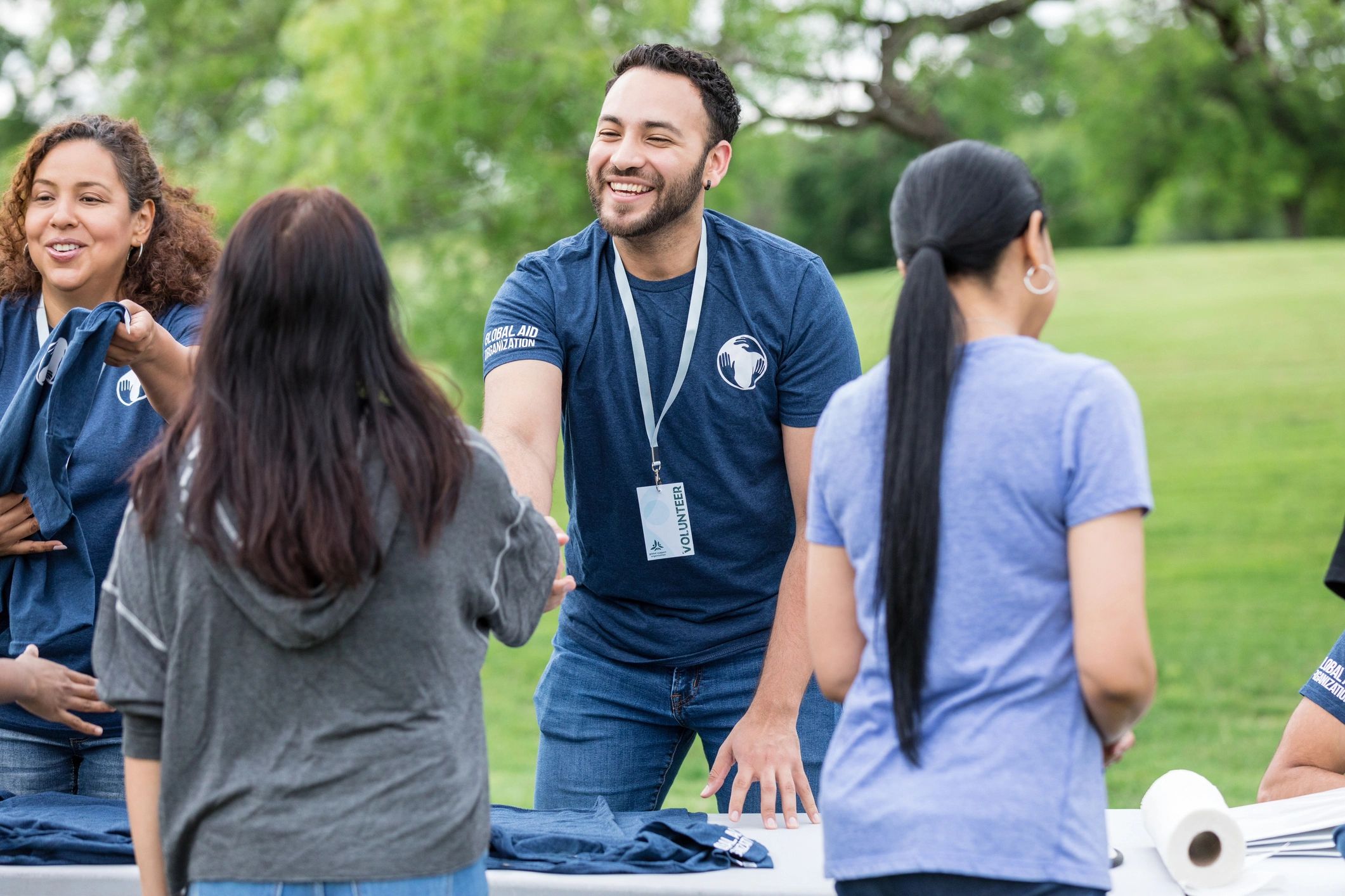 Volunteer greeting a community member